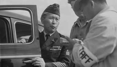 Hikotaro Yamada army veteran opening car door talking to men